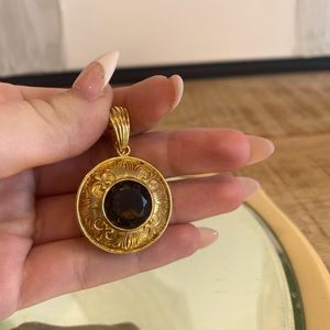 Gold plated purple/black gem pendant